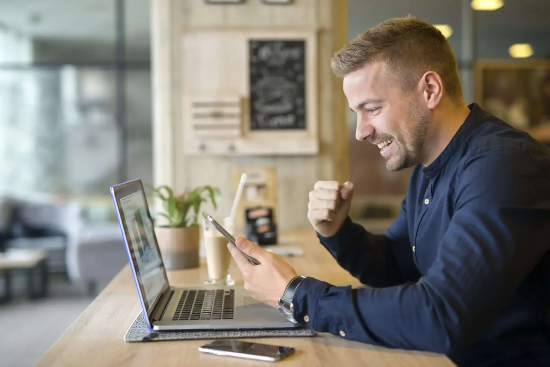 happy freelancer with tablet laptop